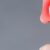 a person point his reddish nose